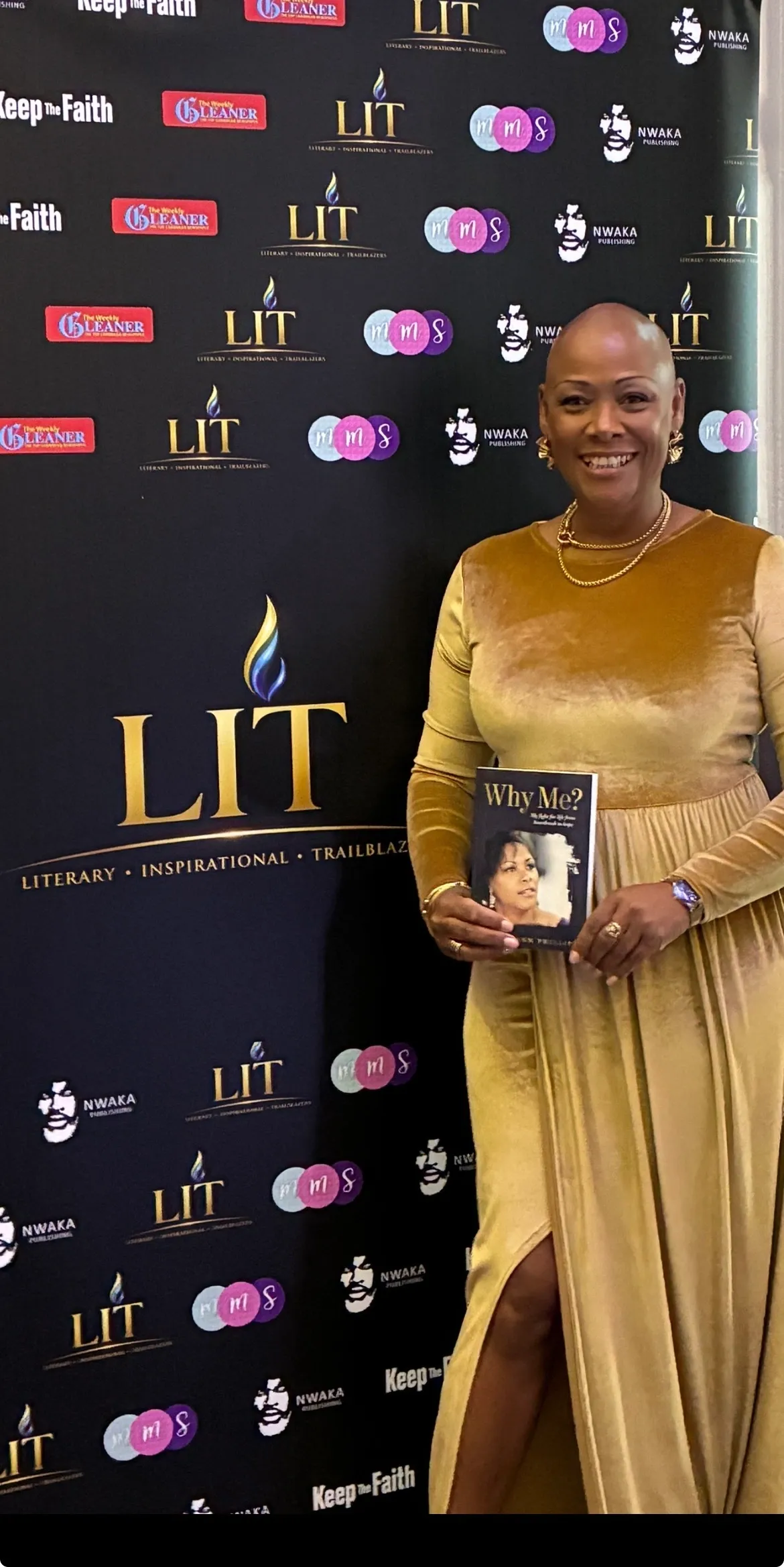 Sharon-Ann Phillips at the LIT Literary Inspirational Trailblazers awards holding her book Why Me?